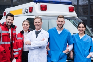 Happy EMS workers with doctors and nurses