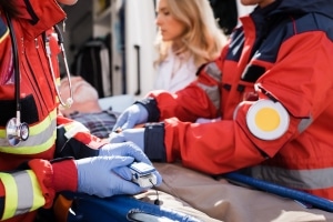 Close up of an EMS team transporting an older man