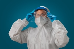 Person in a hazmat suit or protective gear